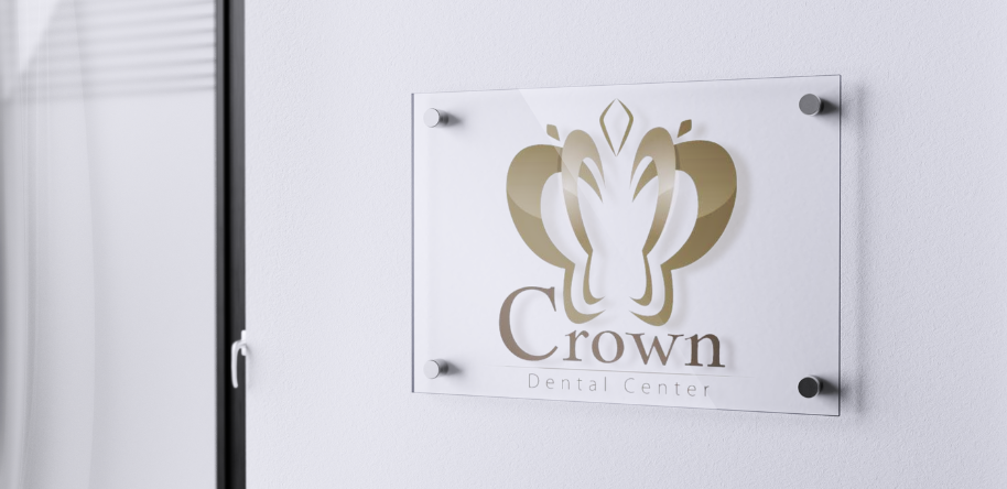 Entrance to Crown Dental Center in Amman, featuring the clinic's distinctive logo.