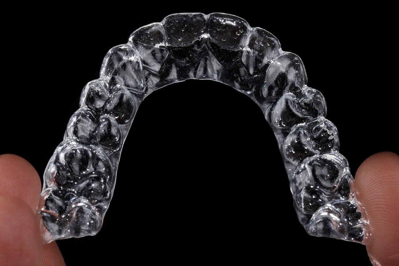 Close-up of clear aligner trays, illustrating the discreet way to straighten teeth