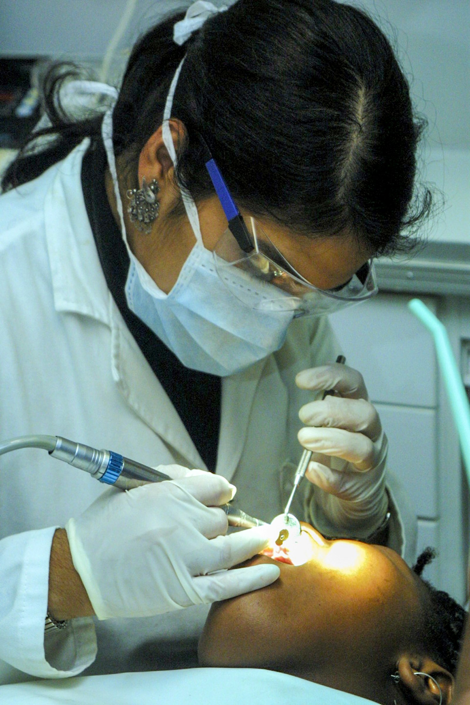 A dentist preparing to perform a procedure for dental implants in Amman.