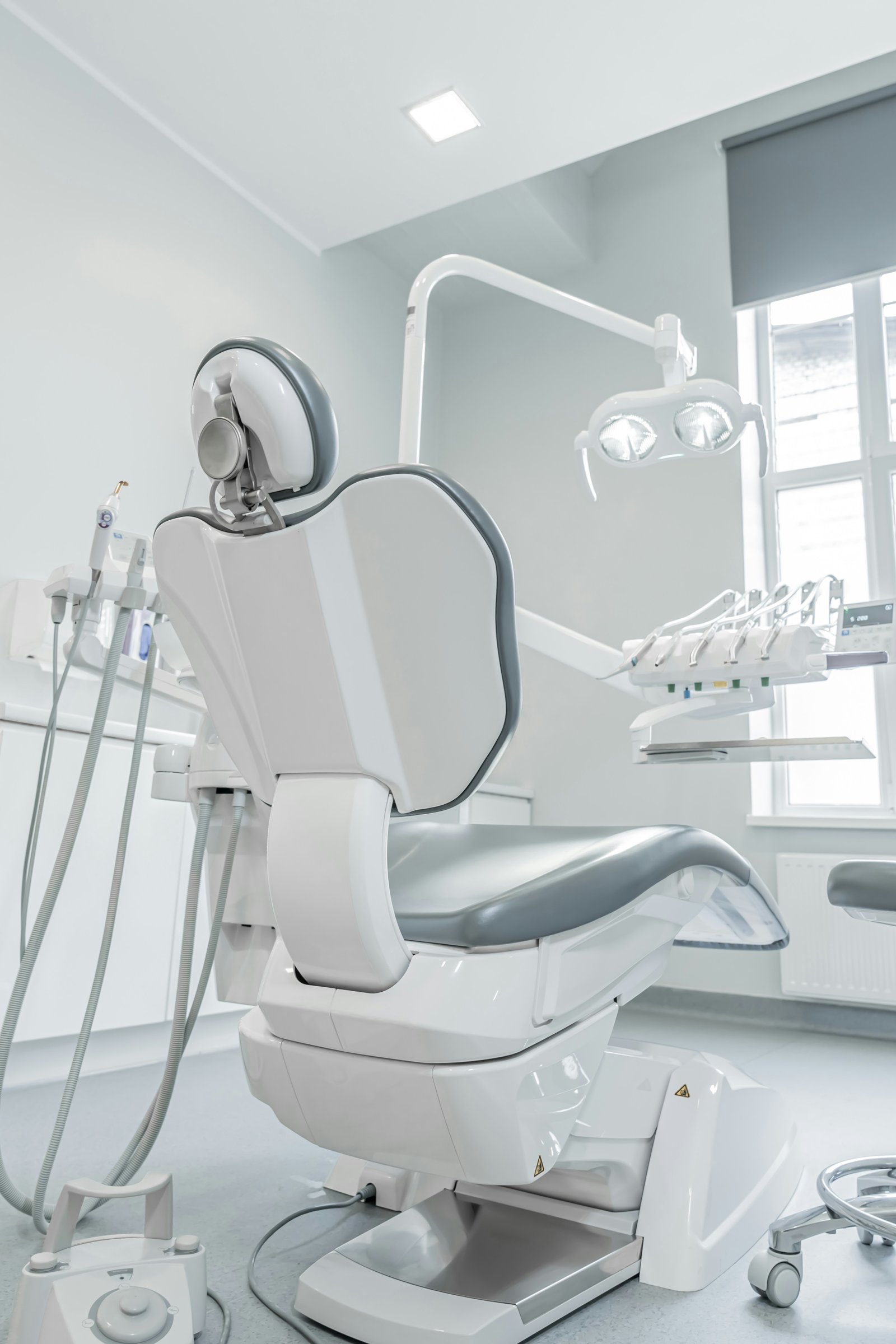 A modern, comfortable dentist chair in the treatment room at Crown Dental Clinic.